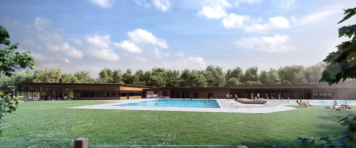 Fasade av grøntområder med utendørs svømmebasseng og anlegg i bakgrunnen